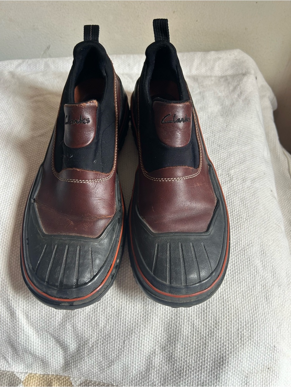 Clarks Men’s Brown and Black Slip-On Loafers with Orange Accent